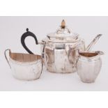 A three piece silver tea service by the Goldsmiths & Silversmiths Company comprising of a teapot