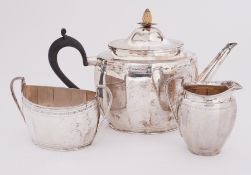 A three piece silver tea service by the Goldsmiths & Silversmiths Company comprising of a teapot