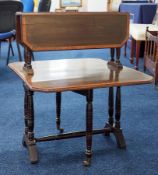 An Edwardian double Sutherland mahogany and crossbanded tea table