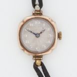 Rolex, a period ladies 9ct yellow gold mechanical Rolex wristwatch on black leather strap, stamped