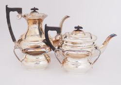 A silver tea service to include a silver teapot, 22oz, a silver milk pourer, 6.43oz, a silver two