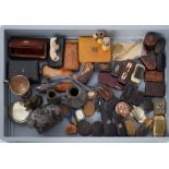 An interesting collection of various snuff boxes, carvings, turned wood pipes, novelty scent