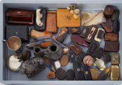 An interesting collection of various snuff boxes, carvings, turned wood pipes, novelty scent