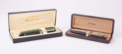 Four pens, including Iridium German also a gold plated Parker 14k nib cased.