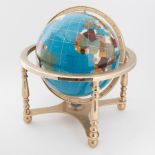 A modern table top inlaid 'gemstone' globe.