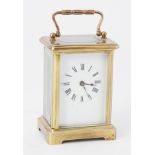 Small French carriage clock with platform escapement and key, height 15cm handle up.