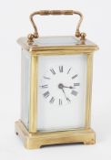 Small French carriage clock with platform escapement and key, height 15cm handle up.