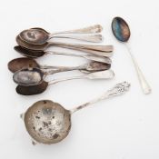 Silver and pierced tea strainer together with nine assorted silver spoons, approx 6oz.