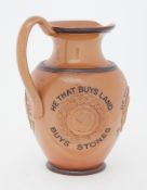 A Doulton Lambeth jug with inscription 'He that buys land, buys stones, He that buys flesh, buys