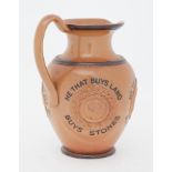 A Doulton Lambeth jug with inscription 'He that buys land, buys stones, He that buys flesh, buys