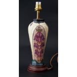 Moorcroft, table lamp on cream ground decorated with fox gloves, height 23cm together with shade.