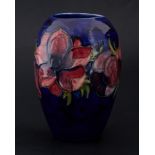 Moorcroft early vase signed WM, poppy's on blue ground, 18cm.