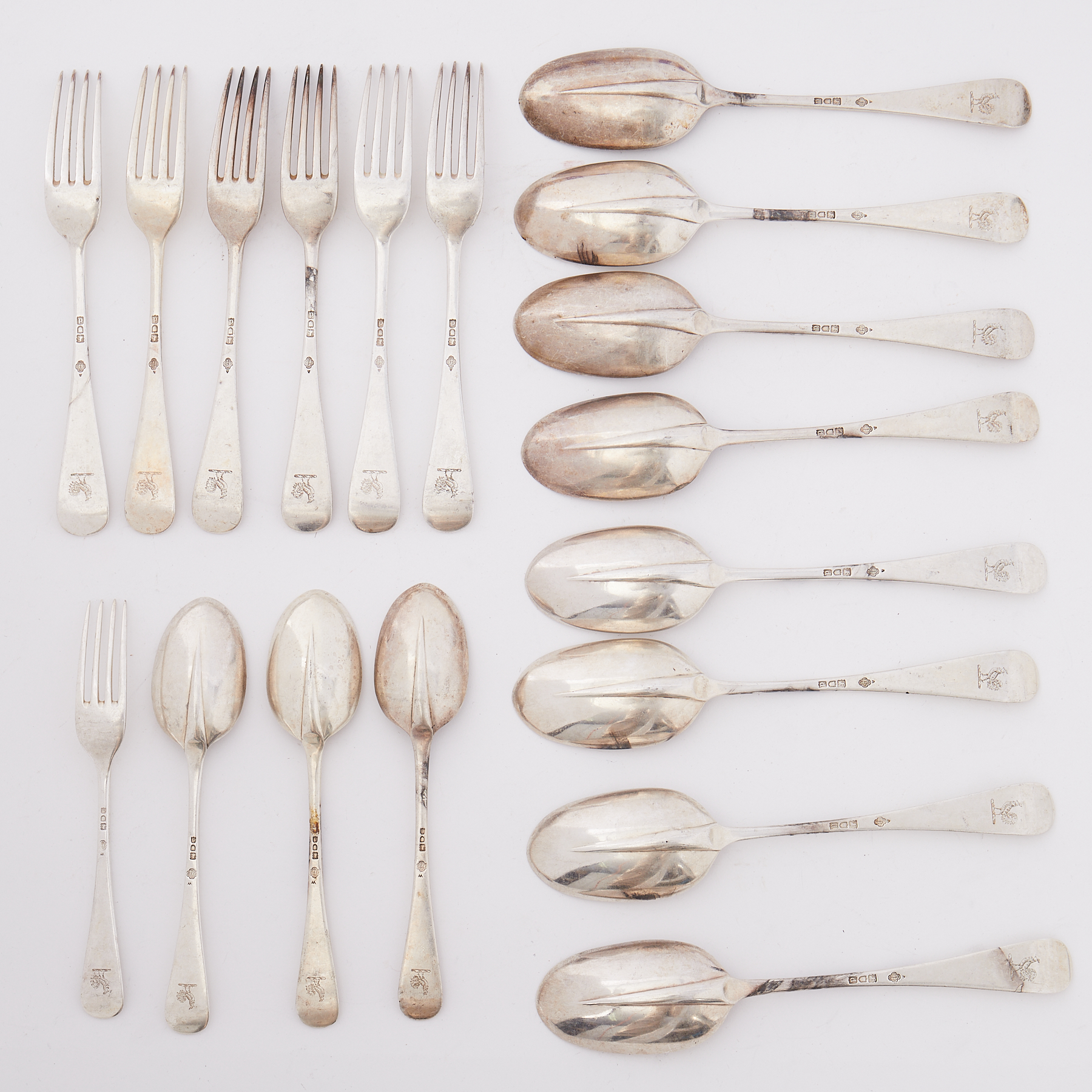 Twenty pieces of 19th century silver flatware including eight rat tail table spoons London, each