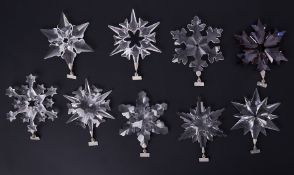 Swarovski Crystal Glass, a large collection of Christmas star hanging decorations including annual