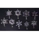 Swarovski Crystal Glass, a large collection of Christmas star hanging decorations including annual