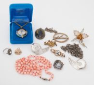 An interesting mixed lot of jewellery to include a string of coral beads, 31.00gm, an Eidelweiss