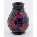 A Moorcroft 'Rose' design miniature vase, height 10cm.