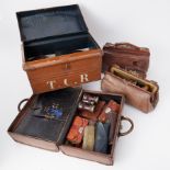 Two gladstone bags, tin trunk and a leather 19th century travel case by Insall, Bristol, all