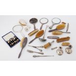 Various silver and white metal back dressing table brushes and mirrors together with a silver