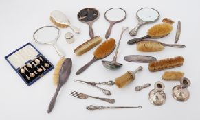 Various silver and white metal back dressing table brushes and mirrors together with a silver