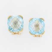 A pair of 18ct yellow gold earrings set with a fancy mixed cut blue topaz, measuring approx. 14mm