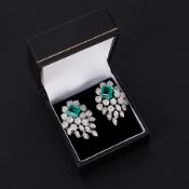 A pair of impressive 18ct white gold cocktail style earrings each set with a central square cut