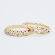 Two rings to include an 18ct yellow gold seven stone ring set with older round cut diamonds, 3.34gm,