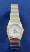 Omega, a ladies bi-metal Omega Constellation wristwatch with white mother of pearl face, diamond dot