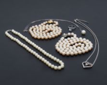 A mixed lot to include three strands of faux pearls, one stamped Christian Dior on the clasp, a 9k