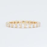 An 18ct yellow gold full eternity style ring set with 1.00 carat total weight of round brilliant cut