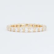 An 18ct yellow gold full eternity style ring set with 1.00 carat total weight of round brilliant cut