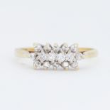 An 18ct yellow & white gold ring set with small round brilliant cut diamonds, total diamond weight