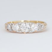 An antique 18ct yellow gold five stone graduated ring set with five old round brilliant cut