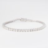 An 18ct white gold line bracelet set with approx. 5.11 carats of round brilliant cut diamonds,