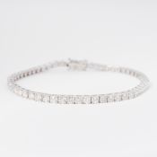 An 18ct white gold line bracelet set with approx. 5.11 carats of round brilliant cut diamonds,