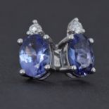 A pair of 18ct white gold earrings set with an oval cut tanzanite, total weight 1.74 carats with a