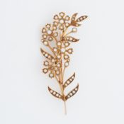 A 15ct yellow gold flower & leaf spray brooch set with seed pearls, length approx. 6cm, 9.76gm.