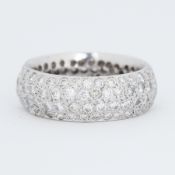 A full eternity style ring set with four rows of pave set round brilliant cut diamond, each