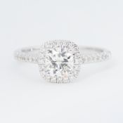 An 18ct white gold set with a central cushion cut diamond, approx. 1.10 carats, approx. colour I-J