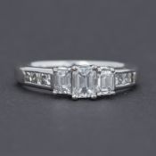 A fine 18ct white gold ring set with 1.00 carat total weight of diamonds which comprises of three