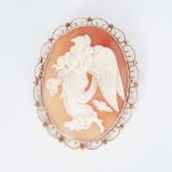 A large 9ct yellow gold cameo brooch with safety chain, measuring approx. 7cm x 5cm (this includes