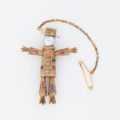 A 9ct yellow gold textured 'scarecrow' brooch, circa 1970's, set with a pearl, rubies, sapphires &