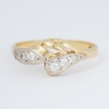 An 18ct yellow gold cross-over style ring set with small round brilliant cut diamonds, 2.55gm,