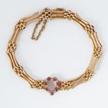 A 15ct yellow gold three bar gate bracelet with a cut-out ruby & diamond heart, circa 1920, total