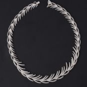 A fine 18ct white gold 'feather' design necklace set with approx. 6.47 carats of round brilliant cut