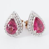 A pair of white gold pear shaped earrings set with a pear shaped pink tourmaline, approx. 2.20