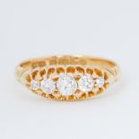 An antique 18ct yellow gold five stone ring set with five graduated old cut diamonds, total