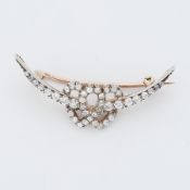 An antique intertwined double heart curved bar brooch set with old round cut diamonds, measuring