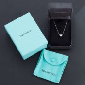 A Tiffany & Co platinum & diamond 'Diamonds by the Yard' pendant by Elsa Peretti, rub-over setting