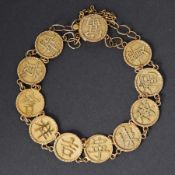 An Oriental 18ct yellow gold bracelet with eleven round gold discs with applied Chinese symbols,